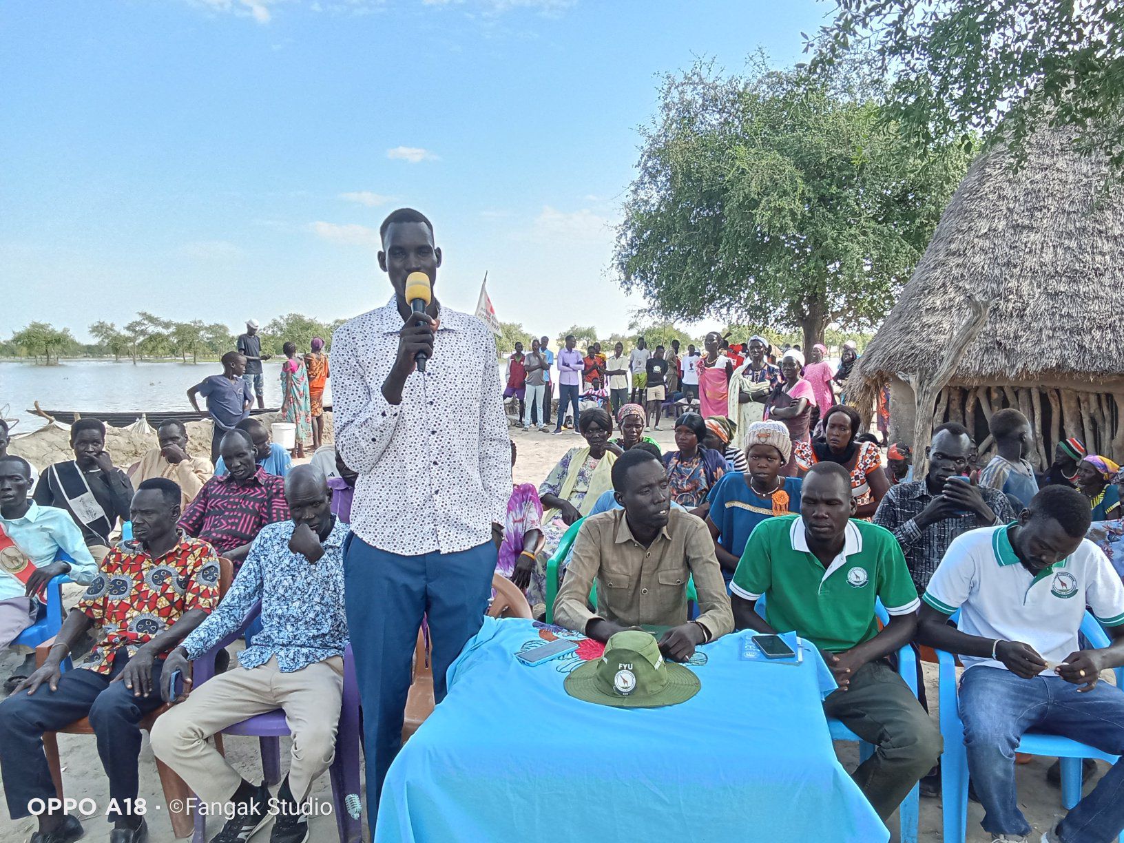 Fangak youth holding a meeting with the community to discuss emergency response to the floods
